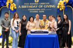 Andi Raharja Limbunan bersama keluarga dalam perayaan ulang tahun dengan dekorasi biru dan emas.